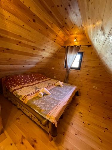 an overhead view of a bed in a log cabin at Family home MASA in Žabljak