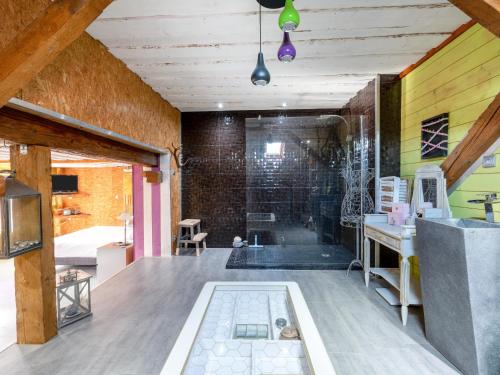 a bathroom with a shower with a tub at La Maison de Max - avec terrasse in Saulxures-sur-Moselotte
