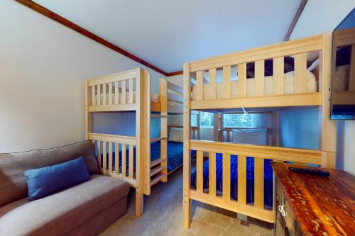 a living room with two bunk beds and a couch at Adi Geda Mountain Retreat in Silverthorne