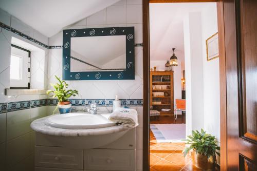 a bathroom with a sink and a mirror at Best Houses 31 - Seashell House in Baleal