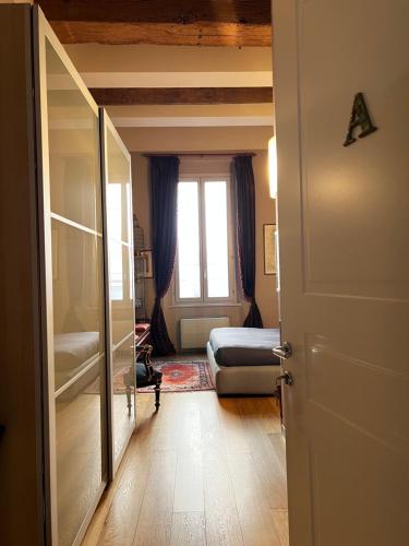 a room with a bedroom with a bed and a window at A Casa Di Paola Suite in Ravenna