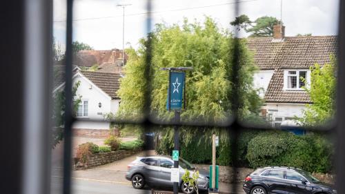 a view from a window of a street with cars at The Star Inn in Lingfield