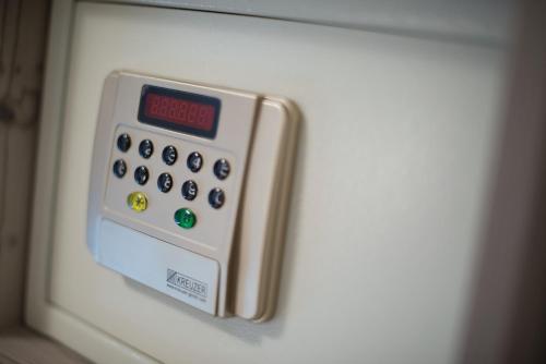 a close up of an electronic device on the side of a refrigerator at Motel 267 in Sankt Pölten