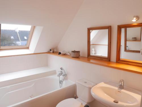 a bathroom with a toilet and a tub and a sink at Maison Sauzon, 5 pièces, 6 personnes - FR-1-418-82 in Sauzon