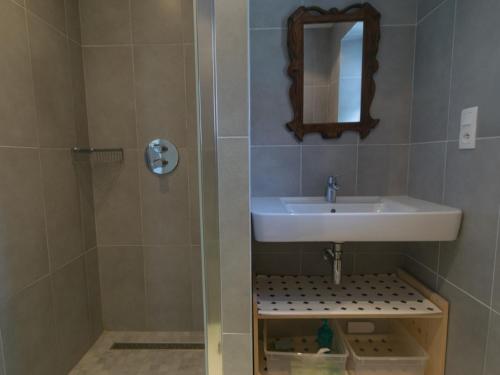 a bathroom with a sink and a shower at Maison Le Palais, 2 pièces, 3 personnes - FR-1-418-88 in Le Palais