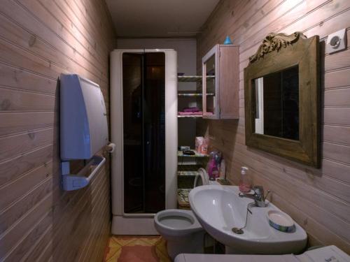 a bathroom with a sink and a toilet and a mirror at Appartement Le Palais, 3 pièces, 4 personnes - FR-1-418-83 in Le Palais