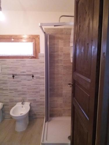 a bathroom with a shower and a toilet and a sink at B&B Il Pittore in Borgo San Lorenzo