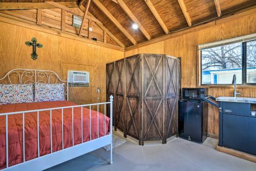 a bedroom with a bed and a sink in a room at Waterfront Studio with Fire Pit on Lake Dunlap! in New Braunfels