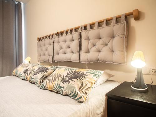 a bedroom with a bed with a large headboard at Residencial Bia d'Olaf in Santa Maria