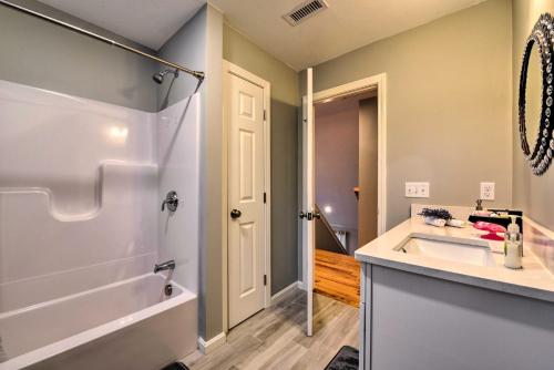 a bathroom with a tub and a sink and a shower at Worcester Vacation Rental with Ideal Location! in Worcester