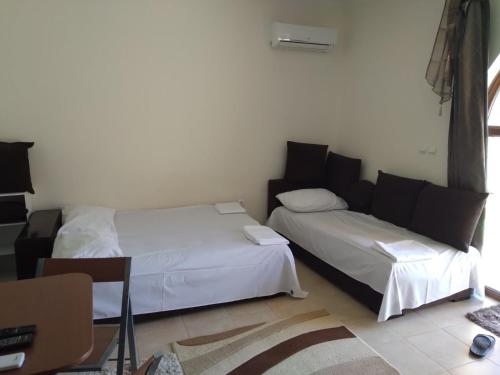 Llit o llits en una habitació de Курортен коплекс Елените,община Несебър,област Бургас