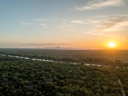 an aerial view of a forest at sunset at Bosveld Villa in Marloth Park