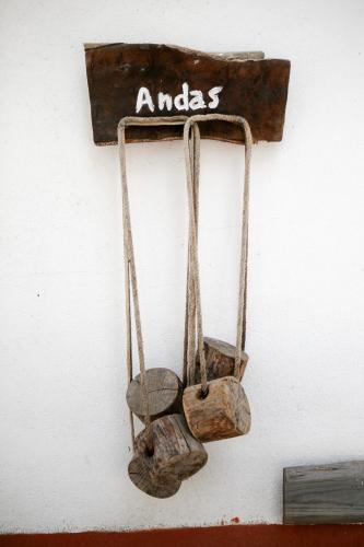 a sign that says andacs hanging on a wall at Monte Do Areeiro in Coruche