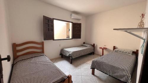 Ένα ή περισσότερα κρεβάτια σε δωμάτιο στο Casa da Elena (Porto de Galinhas) - até 17 pessoas