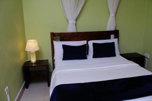 Postel nebo postele na pokoji v ubytování MAMIKKI Hotel Apartments