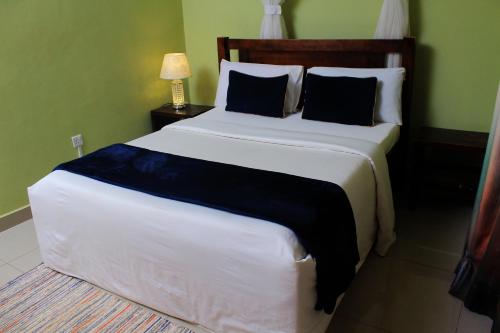 Postel nebo postele na pokoji v ubytování MAMIKKI Hotel Apartments