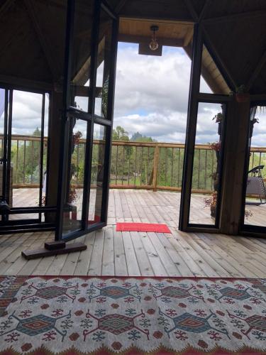 an open room with a rug on a wooden floor at Unique Glamping / Domo Betsaida in Guatapé