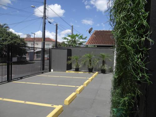 a tennis court in front of a house at BORA BORA RESIDENCE in Joinville