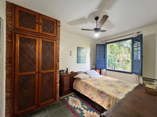 Ένα ή περισσότερα κρεβάτια σε δωμάτιο στο Recanto Lírio da Paz