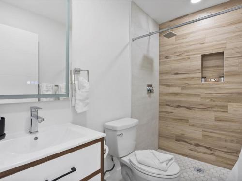a bathroom with a toilet and a sink and a shower at New Villa, Pool, Near Hard Rock 4BR3 in Davie