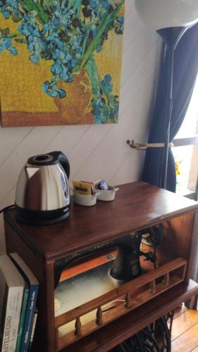 a wooden table with a tea kettle on top of it at Room in Casa Castiglia a Woodhouse with Beautiful View close Madonie Park in Castelbuono