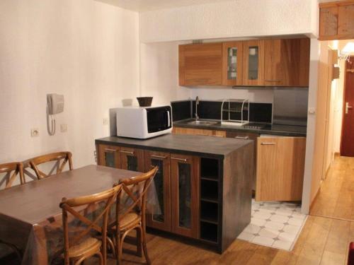 Apartment Studio luxe,ski au pieds.にあるキッチンまたは簡易キッチン