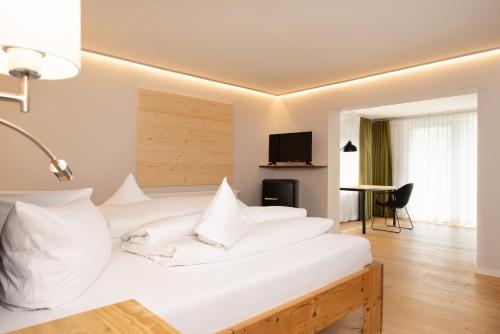 Кровать или кровати в номере freistil Boutiquehotel