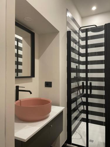 a bathroom with a sink and a glass shower at Ritorno alle origini Suites in Milan