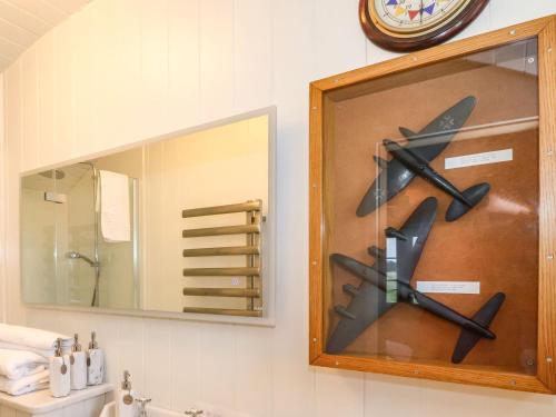 a clock on a wall above a bathroom sink at The Fenton in York