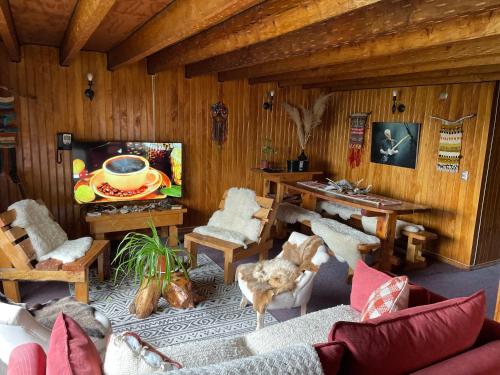 a living room with a couch and a table at Profe Nelson in Puerto Cisnes