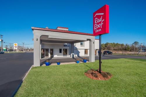 a k rite aid sign in front of a gas station at Red Roof Inn Rocky Mount - Battleboro in Battleboro