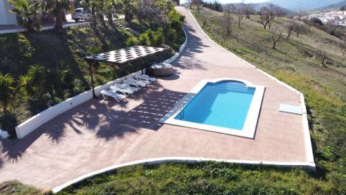 an overhead view of a swimming pool in a backyard at Casa Gala - Caminito del Rey in Málaga