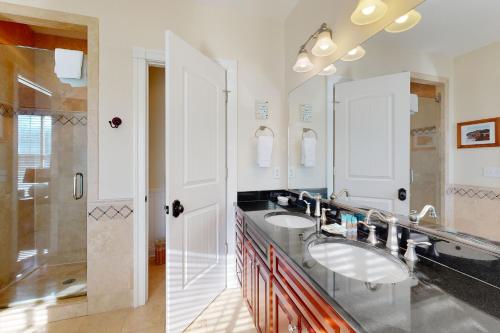 a bathroom with two sinks and a shower at Town of Rehoboth Beach 314 Laurel St in Rehoboth Beach