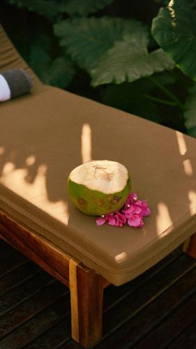 a melon sitting on top of a table at Aldea Paraíso - Adults only - Boutique hotel in Puerto Escondido