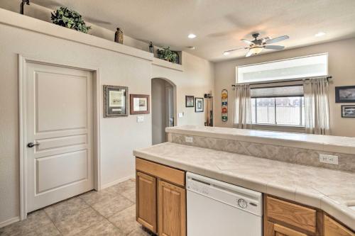a kitchen with a sink and a dishwasher at Cozy Bullhead City Home with Patio and Mountain Views! in Bullhead City