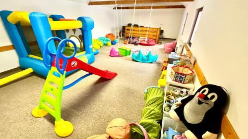 a childs play room with a bunch of toys at Penzion Dolní Morava in Dolní Morava