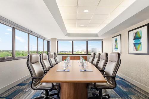 a conference room with a long table and chairs at Holiday Inn Express - San Antonio Airport by IHG in San Antonio