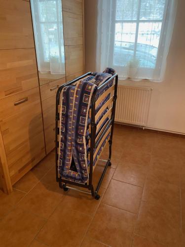 a towel rack in a kitchen next to a window at rekreační dům Pohoda in Jiřetín pod Jedlovou