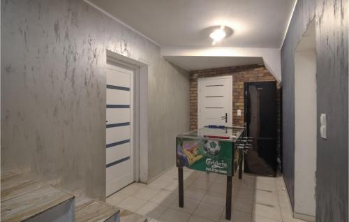 a room with a hallway with a door and a wall at 8 Bedroom Awesome Home In Kamien in Kamień
