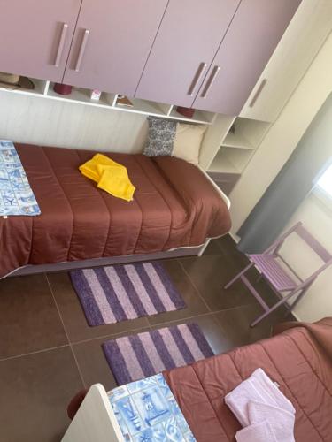 - une chambre avec 2 lits dans l'établissement Blue Sardinia Tourism, à Budoni