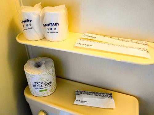a shelf with some rolls of toilet paper on it at Hotel Tsushima - Vacation STAY 64041v in Tsushima
