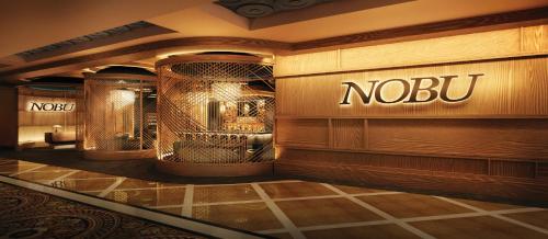 a lobby with a nobu sign on the wall of a store at Caesars Atlantic City Hotel & Casino in Atlantic City