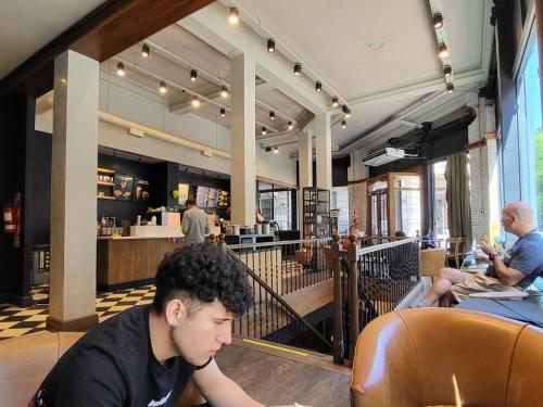 a man sitting at a table in a restaurant at Mi corazon en San Telmo in Buenos Aires