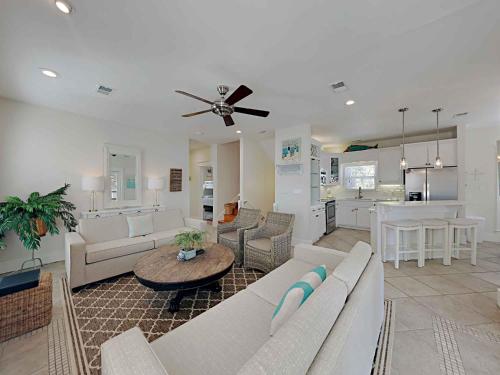 a living room with a couch and a table at Aloha Sandy Bay in Blue Mountain Beach