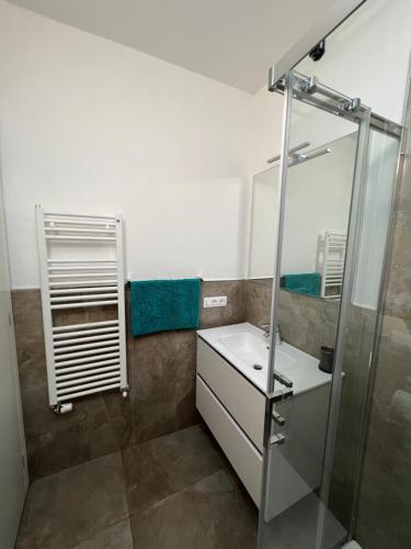 a bathroom with a sink and a shower at Casa del Poeta in Riva Ligure