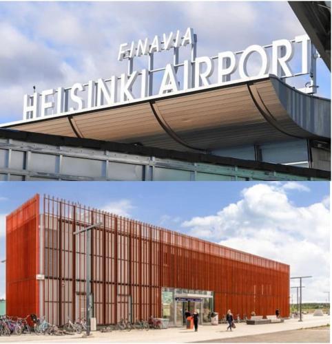 a building with a sign on top of it at New Studio Mint near Airport in Vantaa