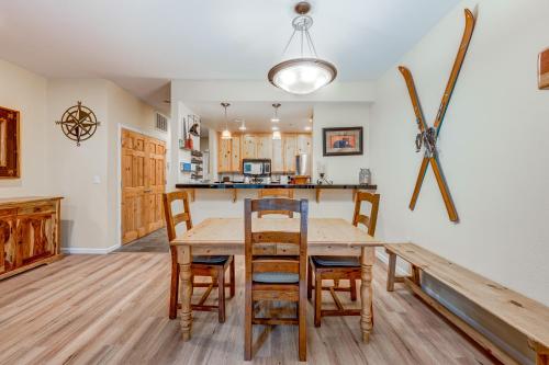 a kitchen and dining room with a wooden table and chairs at Tavern Inn #39 in Olympic Valley