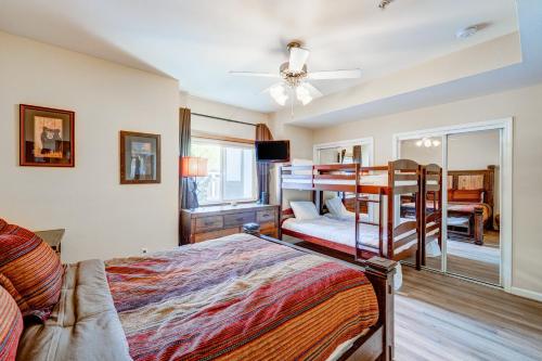 a bedroom with a bunk bed and a living room at Tavern Inn #39 in Olympic Valley