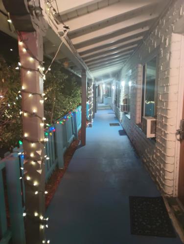 a walkway with lights on the side of a building at Oceana Boutique Hotel in San Clemente