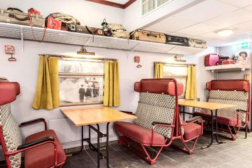 a train room with chairs and a table and a table and chairs at Sure Hotel by Best Western Ole Tobias in Mo i Rana